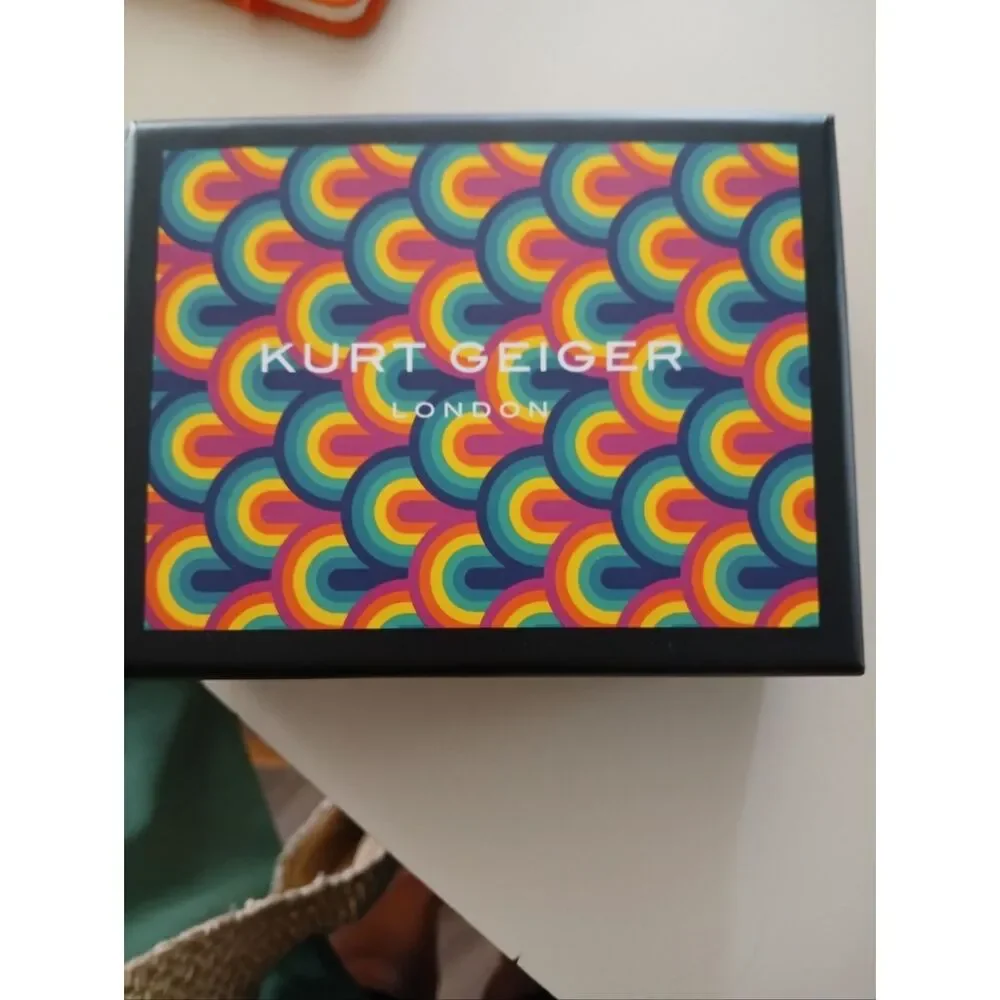 Kurt Geiger teal card holder with gold-tone beetle detail. Orange available too